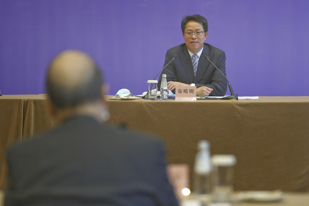 Speaking at the forum are, from far left, Zhang Yong, Luo Huining and Zhang Xiaoming. Regina Ip and Ronny Tong provide details of the discussions. 