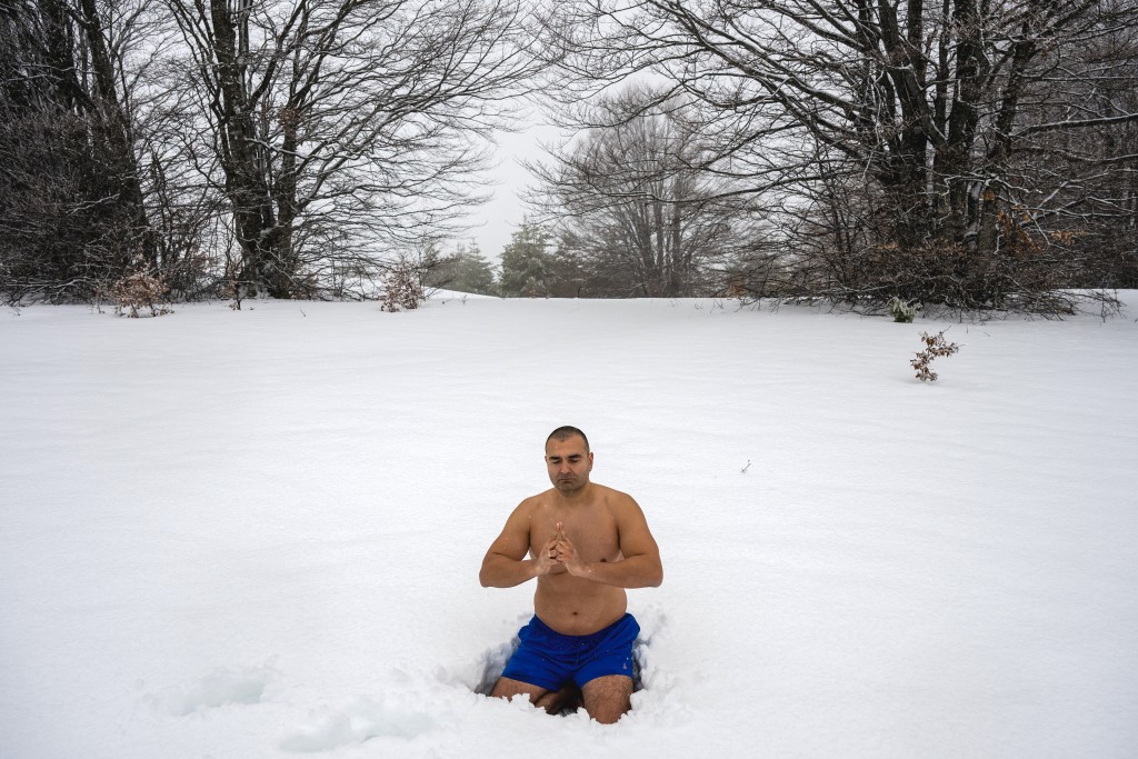 Photo by OLIVER BUNIC / AFP  Serbian archaeologist Vladimir Stevanovic, known on social media as "Serbia's Iceman", meditating on thick snow at the Besna Kobila mountain in Serbia's far south, near the city of Vranje, on January 30, 2026.