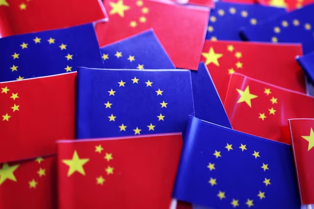 EU and Chinese flags are seen in this illustration taken, March 20, 2025. REUTERS/Dado Ruvic/Illustration 