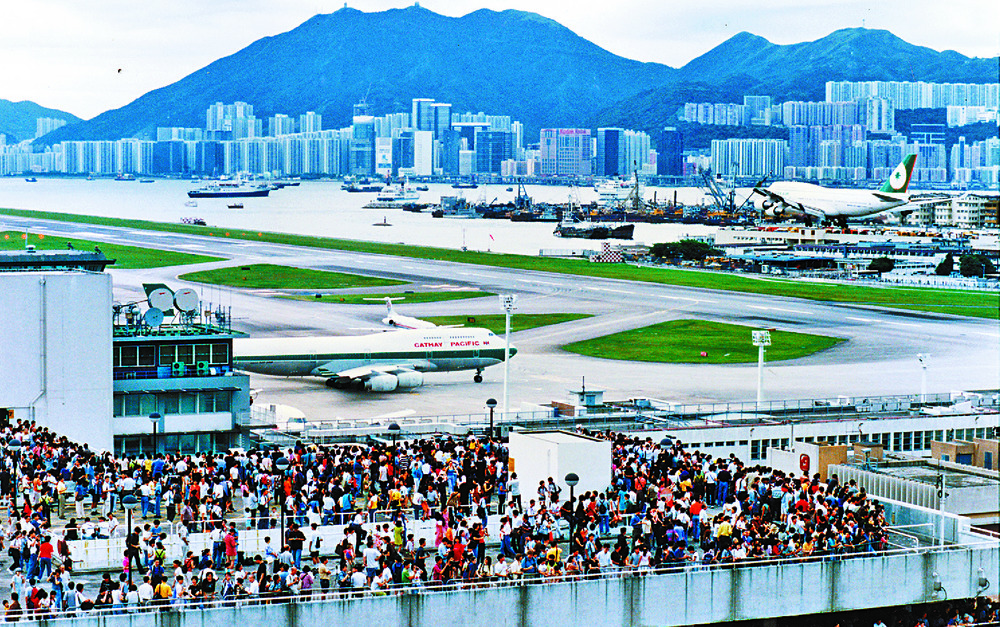 People gather on an observation deck before the Kai Tak Airport shuts down for good in 1998 as residents feel the roar of jets. Far left: Cathay announces the flyby over the new stadium and cruise terminal.Photos: SINGTAO, ISD, CATHAY, Transport and