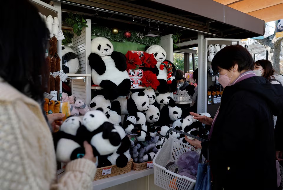 Visitors choose giant panda souvenirs in a shop at Ueno Zoo, a day after news broke that Japan will return two giant pandas to China at the end of January 2026, in Tokyo, Japan, December 16, 2025. REUTERS/Kim Kyung-Hoon