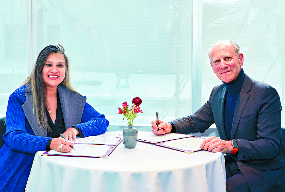 Suhanya Raffel and Glenn David Lowry seal the deal. Below: The Standard report. Suhanya Raffel and Glenn David Lowry seal the deal. Below: The Standard report.