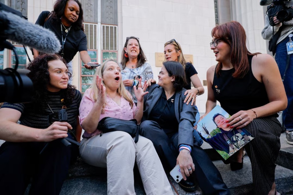 Amy Neville, mother of Alexander, Mary Rodee, mother of Riley Basford, Shelby Knox, lawyer Laura Marquez-Garrett, lawyer Lennon Torres and CEO of Heat Initiative Sarah Gardner react outside the court after the jury found Meta and Google liable in a key test case accusing Meta and Google's YouTube of harming children's mental health through addictive social media platforms, in Los Angeles, California, U.S. REUTERS/Mike Blake