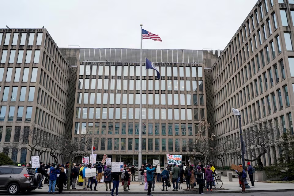 Demonstrators rally during a protest against billionaire Elon Musk, who is heading U.S. President Donald Trump's drive to shrink the federal government, outside the U.S. Office of Personnel Management (OPM) in Washington, U.S. (Reuters) Demonstrators rally during a protest against billionaire Elon Musk, who is heading U.S. President Donald Trump's drive to shrink the federal government, outside the U.S. Office of Personnel Management (OPM) in Washington, U.S. (Reuters)
