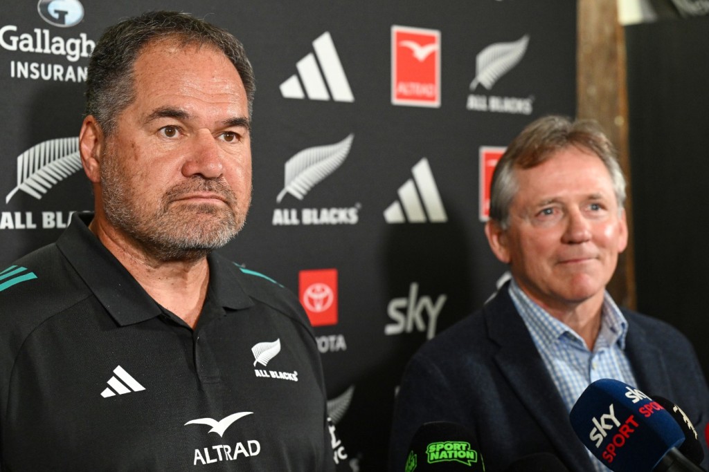 Dave Rennie, left, stands with New Zealand Rugby chairman David Kirk as he is announced as the new All Blacks head coach in Auckland. AP