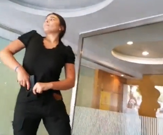 A screenshot from a video of Sali hafiz who held up a Beirut bank to access her sister's savings. (Twitter) A screenshot from a video of Sali hafiz who held up a Beirut bank to access her sister's savings. (Twitter)