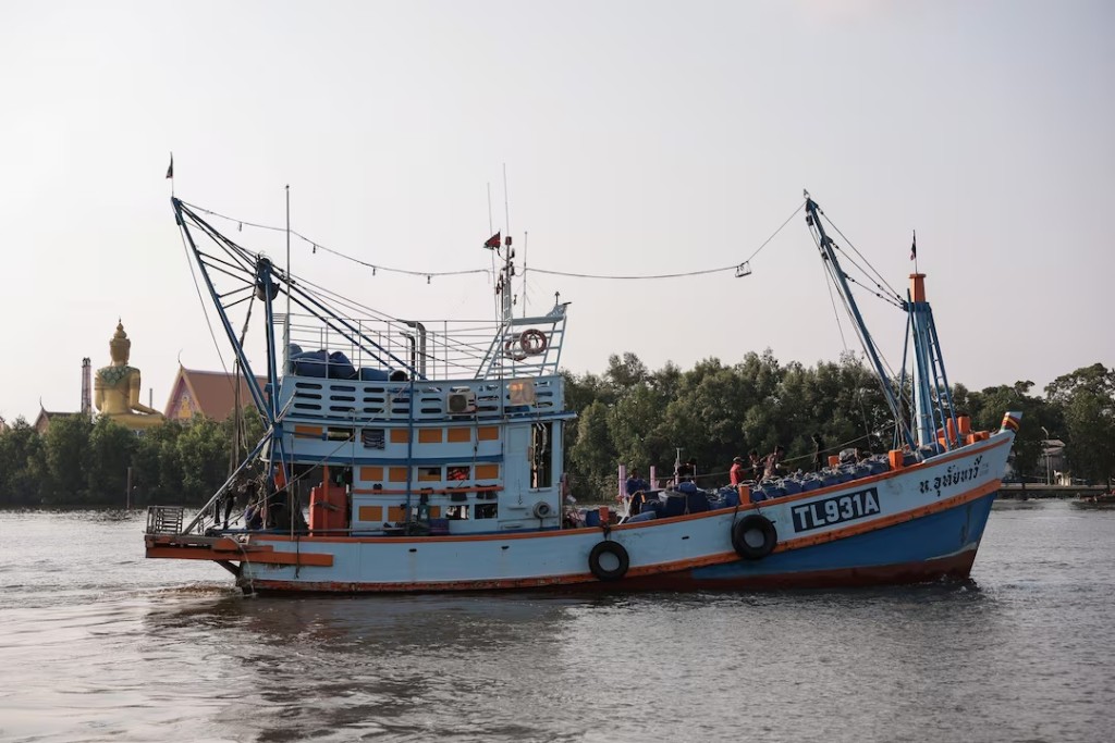 A trawler sails after unloading its catch, as rising diesel prices have left many trawlers docked due to unprofitable operations, in Samut Sakhon province, Thailand, March 25, 2026. REUTERS/Chalinee Thirasupa