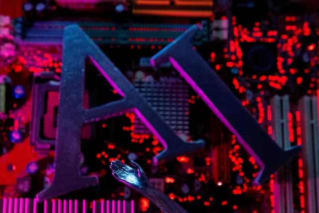 AI (Artificial Intelligence) letters and robot hand are placed on computer motherboard in this illustration created on June 23, 2023. REUTERS/Dado Ruvic/Illustration/File Photo 