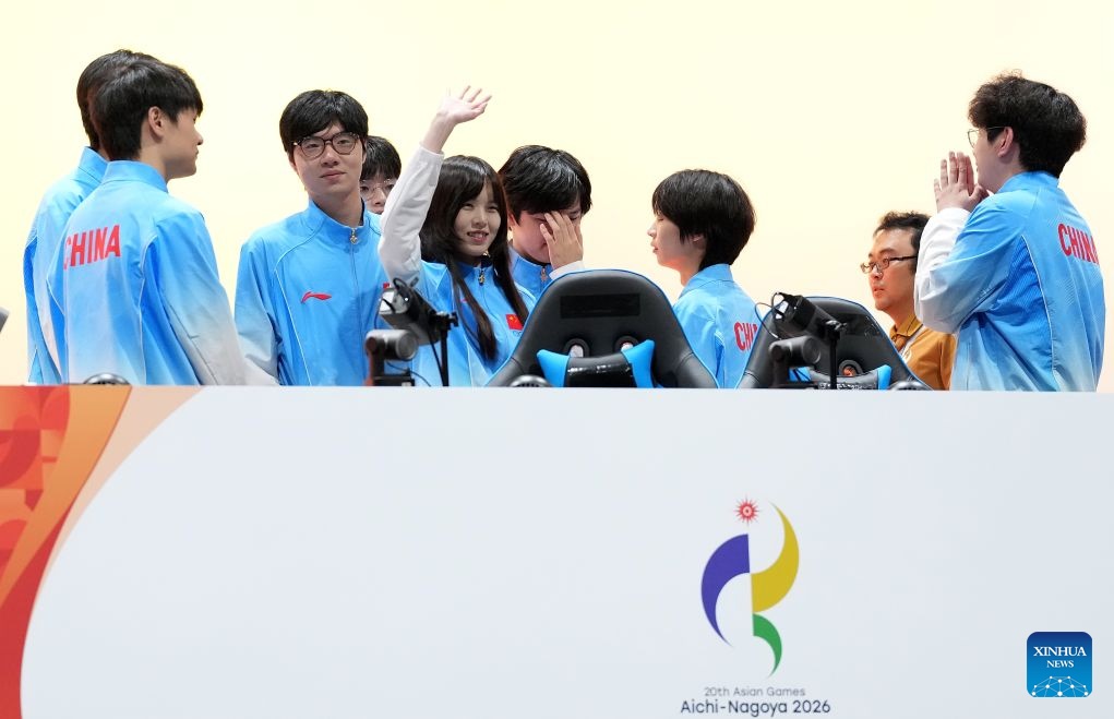 Mu Xinyue (C) of team China celebrates with her teammates after the 1v4 asymmetrical survival game [Identity V - Asian Games Version] final of Esports between team China and team Japan at the 20th Asian Games Aichi-Nagoya 2026 in Tokoname of Aichi Prefecture, Japan, Sept. 30, 2026. (Xinhua/Wang Fei)