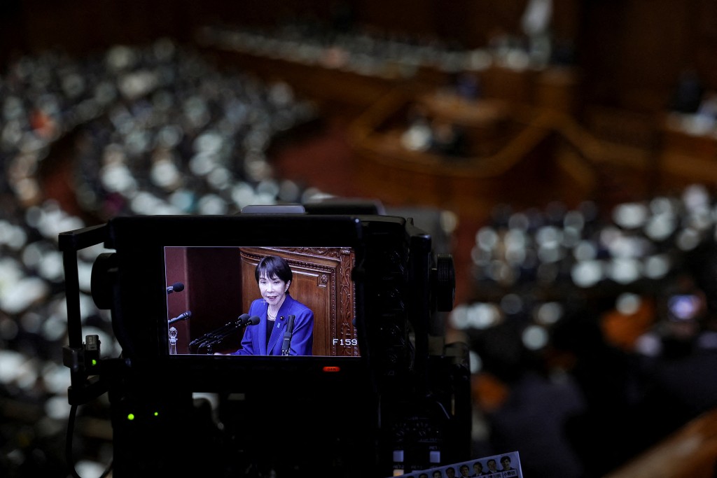 The viewfinder of a camera shows Japan's new Prime Minister Sanae Takaichi as she delivers her first policy speech in the parliament, in Tokyo, Japan, October 24, 2025. (Reuters)