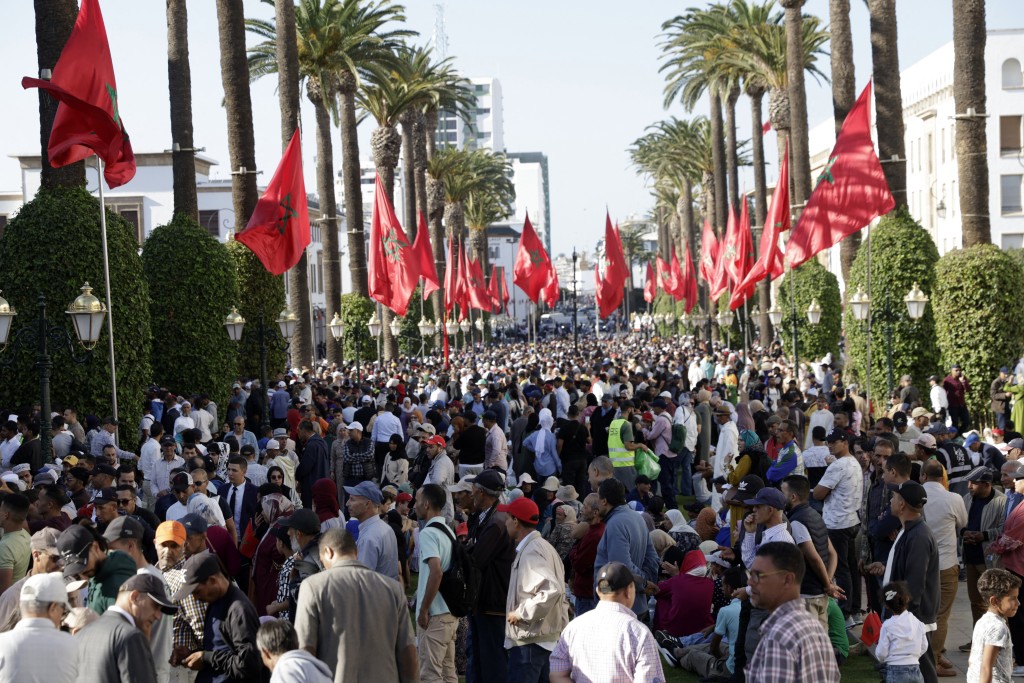 Crowds gather in front of the Moroccan Parliament headquarters in Rabat on October 10, 2025, as the King prepares to chair the opening of the 1st session of 5th legislative year. (Photo by Abdel Majid BZIOUAT / AFP)