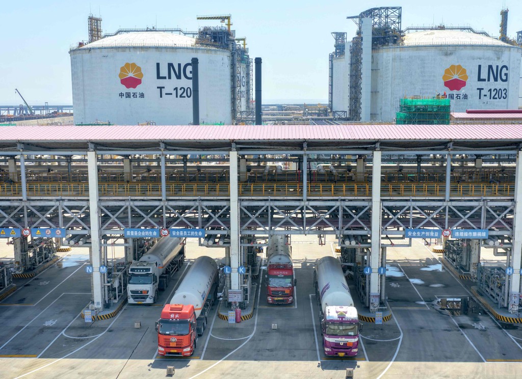 Liquid natural gas tankers wait at a loading station at the PetroChina Jiangsu LNG terminal at Yangkou port in Rudong, in China eastern Jiangsu province on April 24, 2026. (Photo by CN-STR / AFP)