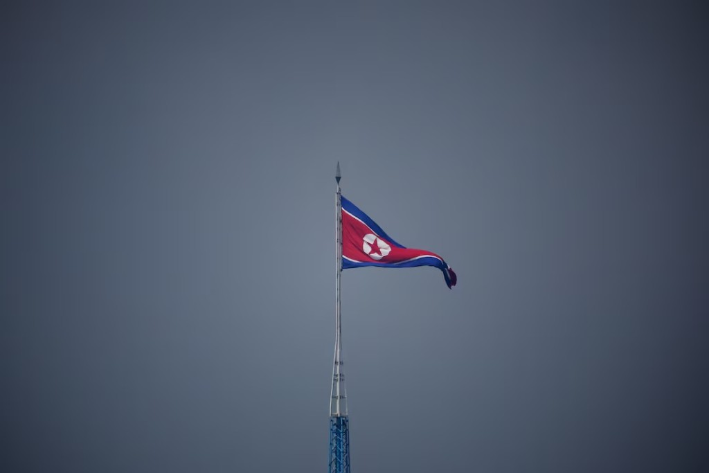 A North Korean flag flutters at the propaganda village of Gijungdong in North Korea, in this picture taken near the truce village of Panmunjom inside the demilitarized zone (DMZ) separating the two Koreas, South Korea, July 19, 2022. REUTERS/Kim Hong-Ji/Pool