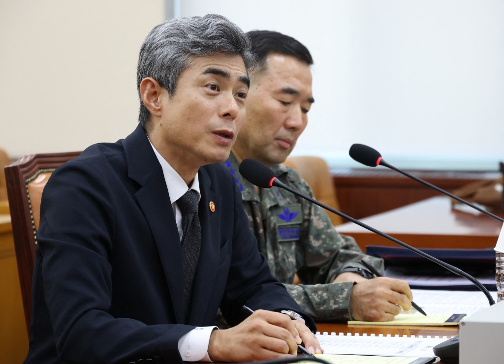 Photo by - / YONHAP / AFP South Korea's Defence Minister Kang Shin-chul (L) speaks during a parliamentary defence committee hearing on the landmine explosion accident in the DMZ, at the National Assembly in Seoul on September 29, 2026.