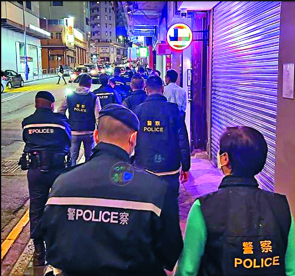 Officers carrying out vaccine pass checks in Tsim Sha Tsui. Officers carrying out vaccine pass checks in Tsim Sha Tsui.