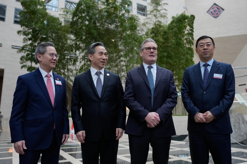 From left, Zheng Zeguang, Chinese ambassador to to Britain, Ren Hongbin, Chairman of the China Council for the Promotion of International Trade (CCPIT), Britain's Prime Minister Keir Starmer and Ge Haijiao, Chairman and Executive Director of the Bank of China Limited (BOC) pose for photos in Beijing, China, Friday, Jan. 30, 2026. (AP Photo/Kin Cheung, Pool)