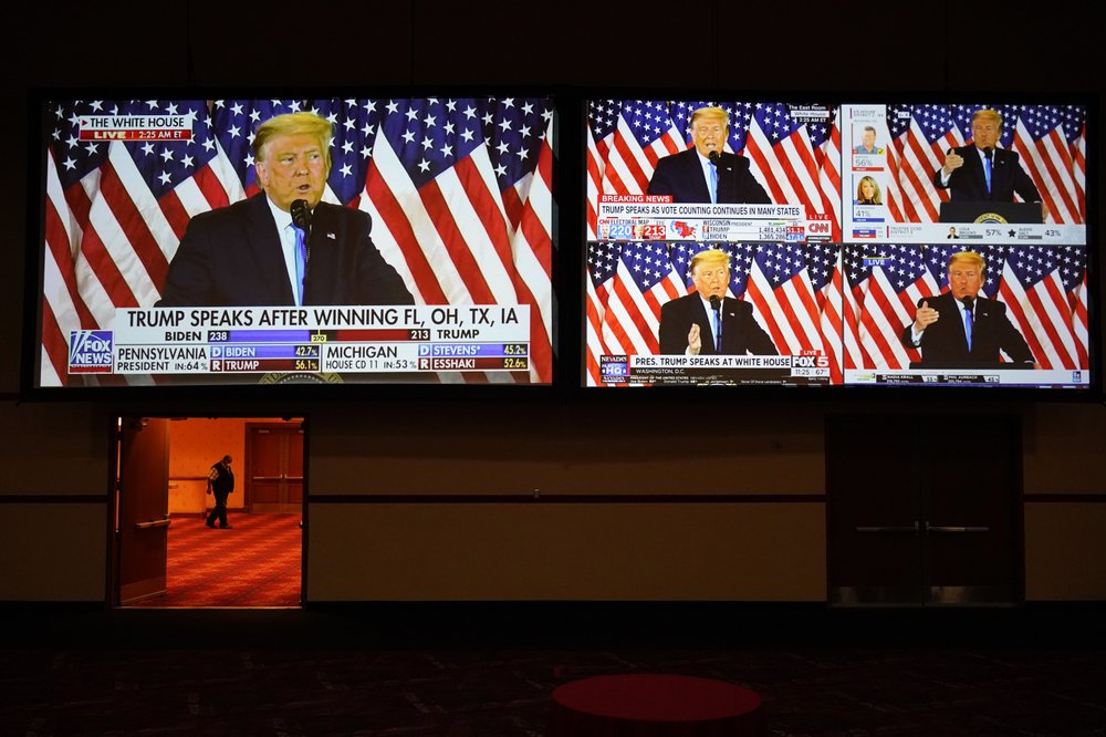 A live broadcast of President Donald Trump speaking from the White House is sown on screens at an election night party, on Tuesday, in Las Vegas, Nevada. A live broadcast of President Donald Trump speaking from the White House is sown on screens at an election night party, on Tuesday, in Las Vegas, Nevada.