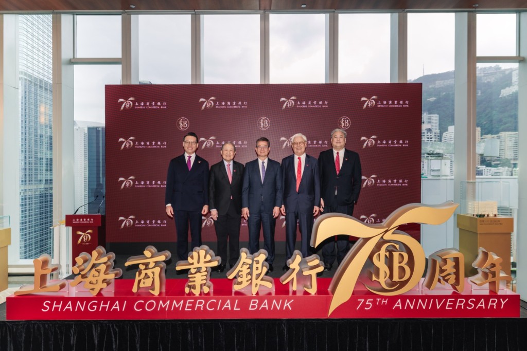 Paul Chan, middle, Stephen Lee, second left, Lincoln Yung, director of The Shanghai Commercial & Savings Bank, second right, John Yung, non-executive director of Shanghai Commercial Bank, first right and Wallace Lam, first left