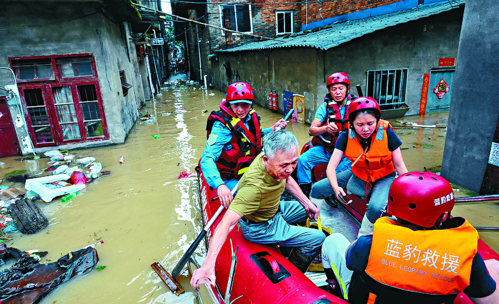 Buildings in Meizhou, Guangdong, are swept away or on the brink of collapsing into the raging river. AFP Buildings in Meizhou, Guangdong, are swept away or on the brink of collapsing into the raging river. AFP