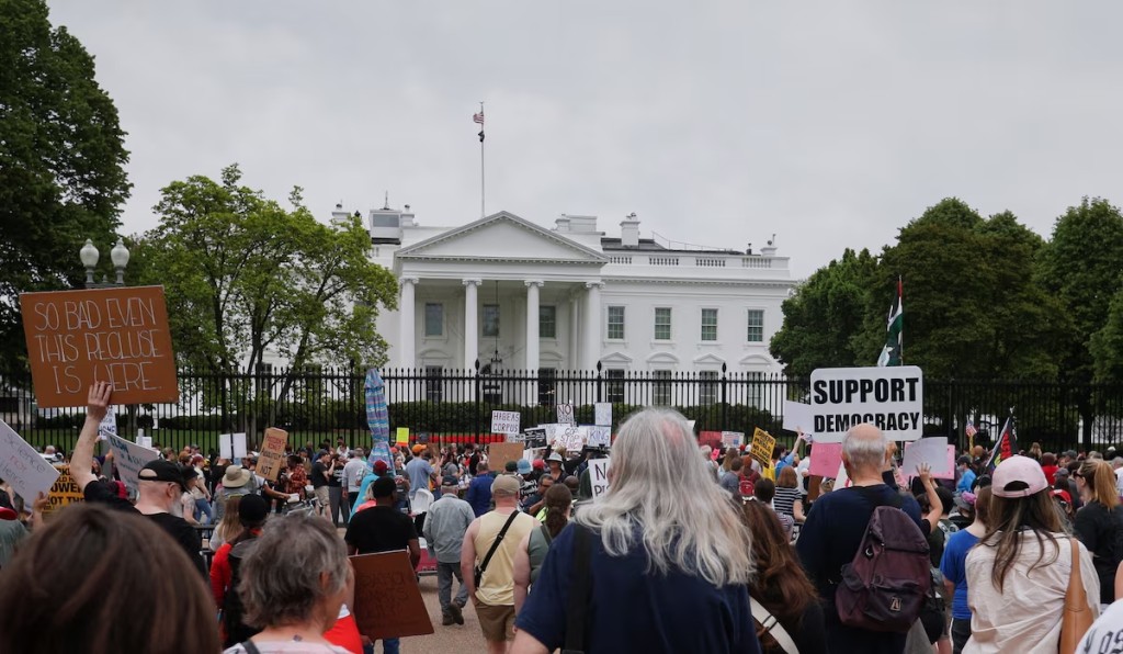 People take part in a protest against U.S. President Donald Trump, tariffs, deportations, a variety of other policies, and Elon Musk at the White House in one of many demonstrations taking place nationwide, in Washington, D.C., U.S., on April 19, 2025. (Reuters)