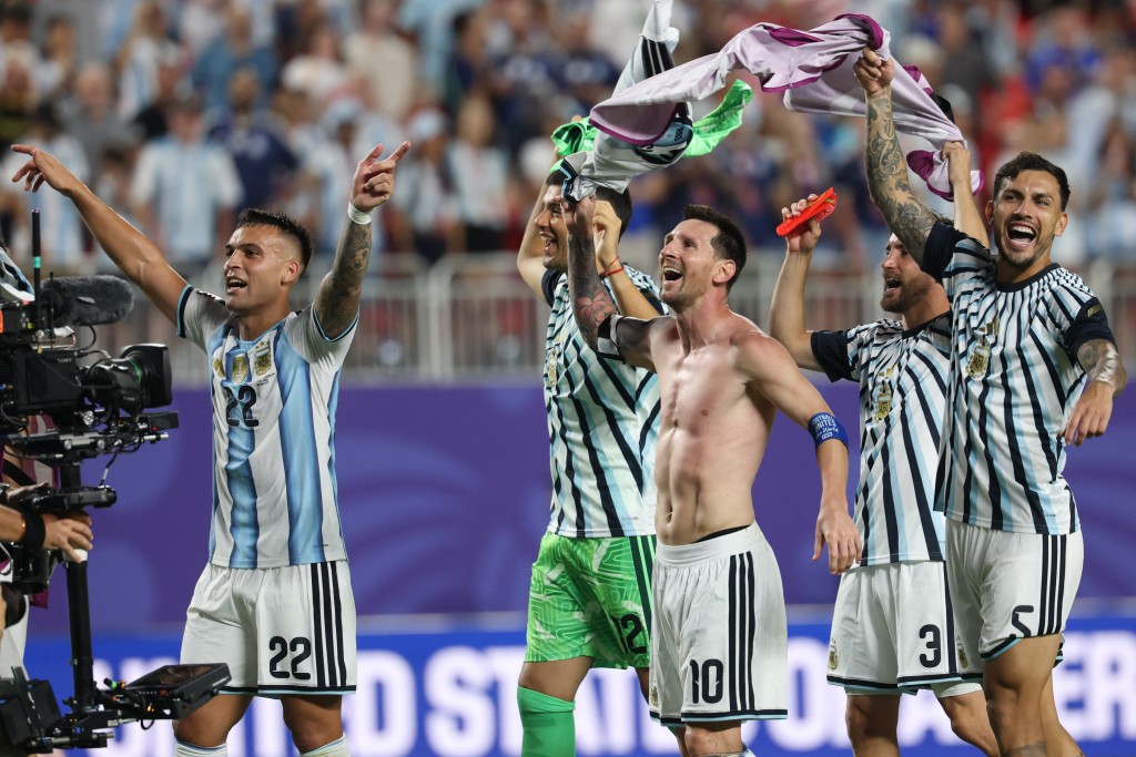 Argentina's forward #22 Lautaro Martinez, goalkeeper #12 Geronimo Rulli, forward #10 Lionel Messi, defender #03 Nicolas Tagliafico and midfielder #05 Leandro Paredes celebrate the 3-1 victory over Switzerland during the 2026 World Cup football tournament quarter-final match between Argentina and Switzerland at the Kansas City Stadium. (AFP)