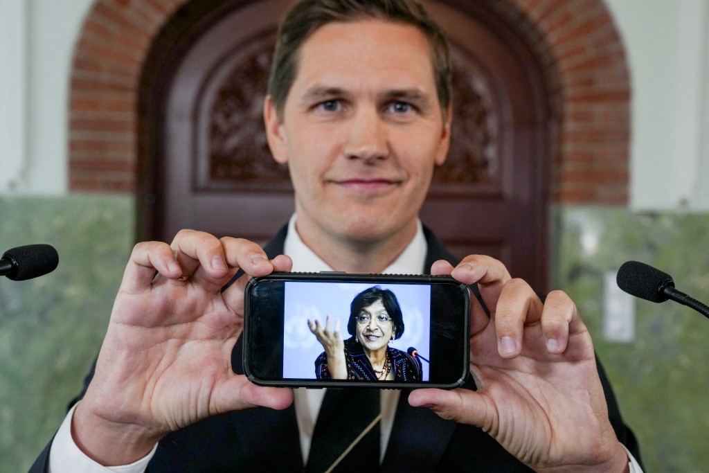 The Chairman of the Nobel Committee, Jørgen Watne Frydnes, shows a mobile phone dispplaying a picture of Navanethem "Navi" Pillay who was awarded the 2026 Nobel Peace Prize at the Nobel Institute in Oslo, Norway, on October 9, 2026.