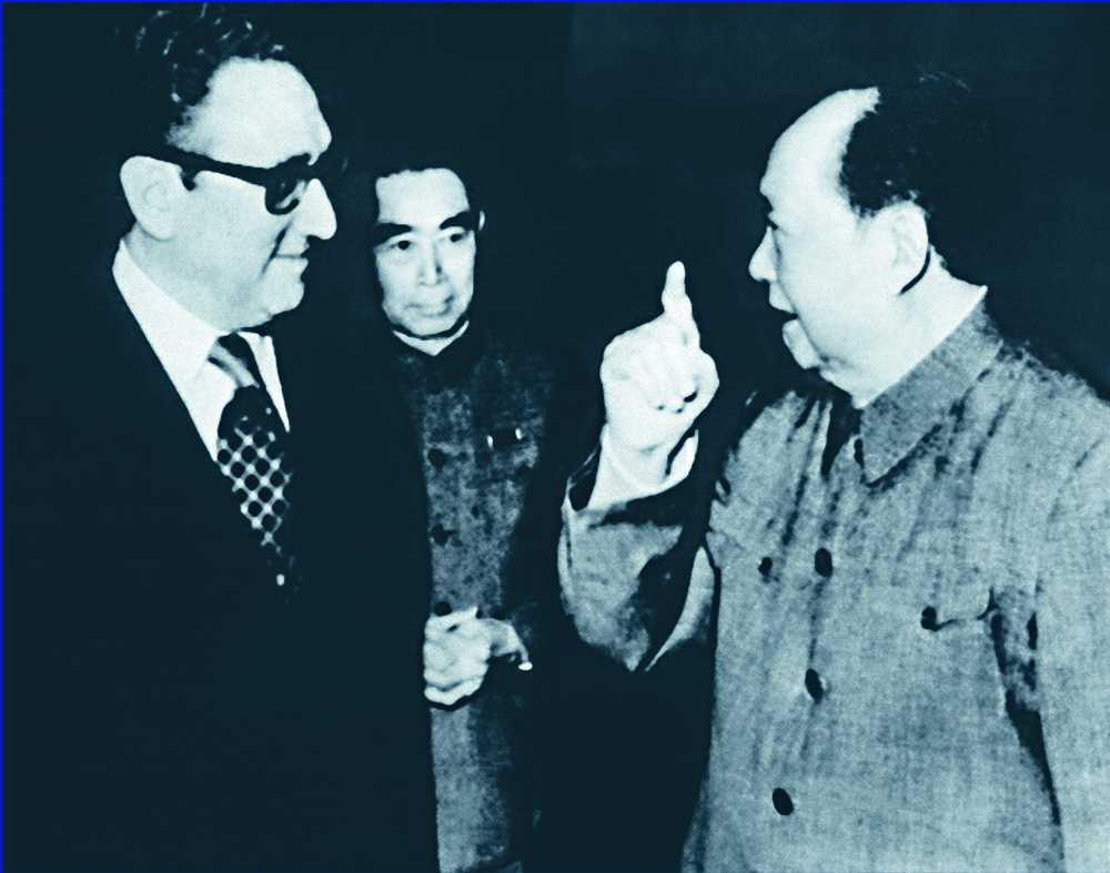 Henry Kissinger meets with chairman Mao Zedong as premier Zhou Enlai looks on in February 1973 and shakes hands with North Vietnam's Le Duc Tho in June of the same year. Below: Kissinger with Richard Nixon on Air Force One in 1972. AFP, REUTERS