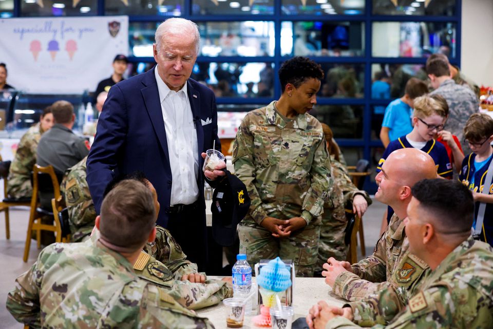 U.S. President Joe Biden has an ice cream as he greets the US troops during his visit to the Air Operations Center at Osan Air Base in Pyeongtaek, South Korea, May 22, 2022. (Reuters) U.S. President Joe Biden has an ice cream as he greets the US troops during his visit to the Air Operations Center at Osan Air Base in Pyeongtaek, South Korea, May 22, 2022. (Reuters)