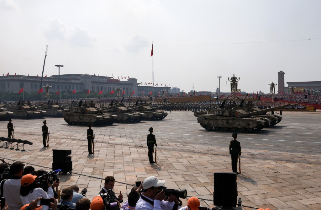 Members of the People's Liberation Army stand as the land operations group displays tanks during a military parade to mark the 80th anniversary of the end of World War Two, in Beijing, China, September 3, 2025. (Reuters)