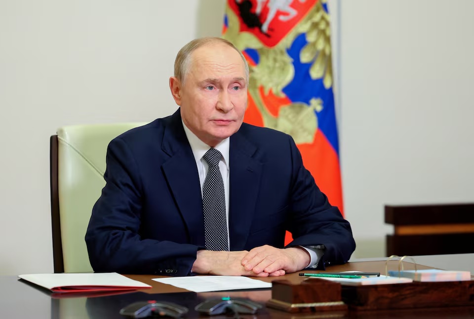 Russian President Vladimir Putin chairs a meeting with members of the Security Council via a video link at the Novo-Ogaryovo state residence outside Moscow, Russia, October 7, 2025. Sputnik/Andrey Babushkin/Pool via REUTERS