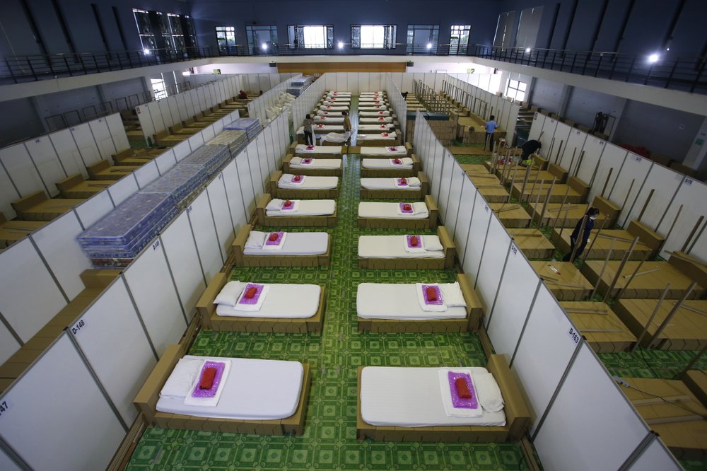 Thai workers prepare a field hospital for coronavirus disease patients in Bangkok, Thailand, Monday, April 12, 2021. Thailand's Health Ministry warned Sunday that restrictions may need to be tightened to slow the spread of a fresh coronavirus wave, as the country hit a daily record for new infections. Thai workers prepare a field hospital for coronavirus disease patients in Bangkok, Thailand, Monday, April 12, 2021. Thailand's Health Ministry warned Sunday that restrictions may need to be tightened to slow the spread of a fresh coronavirus wave, as the country hit a daily record for new infections.