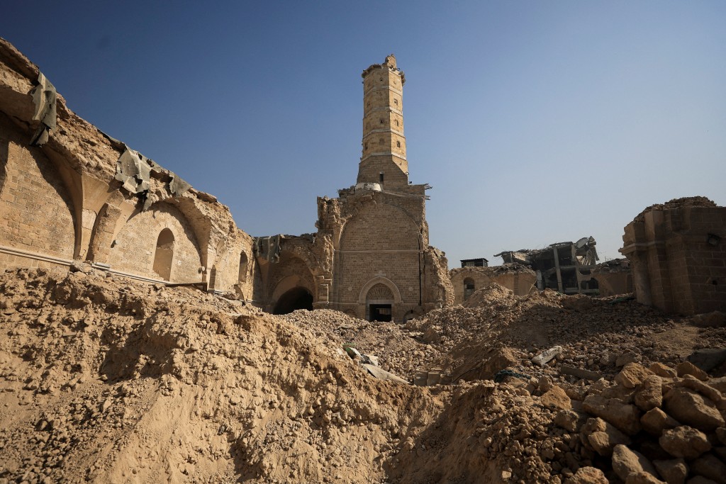 A view of Omari Mosque, which was damaged by Israeli shelling during the war, where Palestinians perform Friday prayers, in Gaza City, November 21, 2025. (Reuters/File)