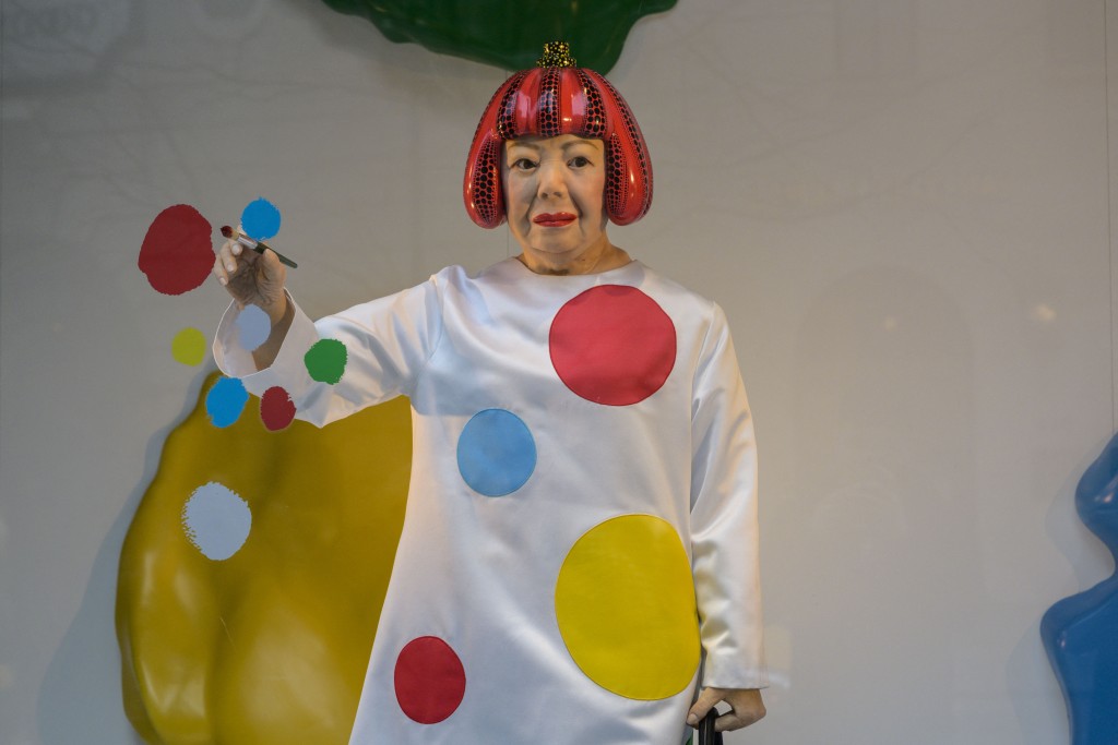 A life-like robot of artist Yayoi Kusama paining a window stands at the Louis Vuitton store on Fifth Avenue in New York City on January 13, 2023. (AFP) A life-like robot of artist Yayoi Kusama paining a window stands at the Louis Vuitton store on Fifth Avenue in New York City on January 13, 2023. (AFP)