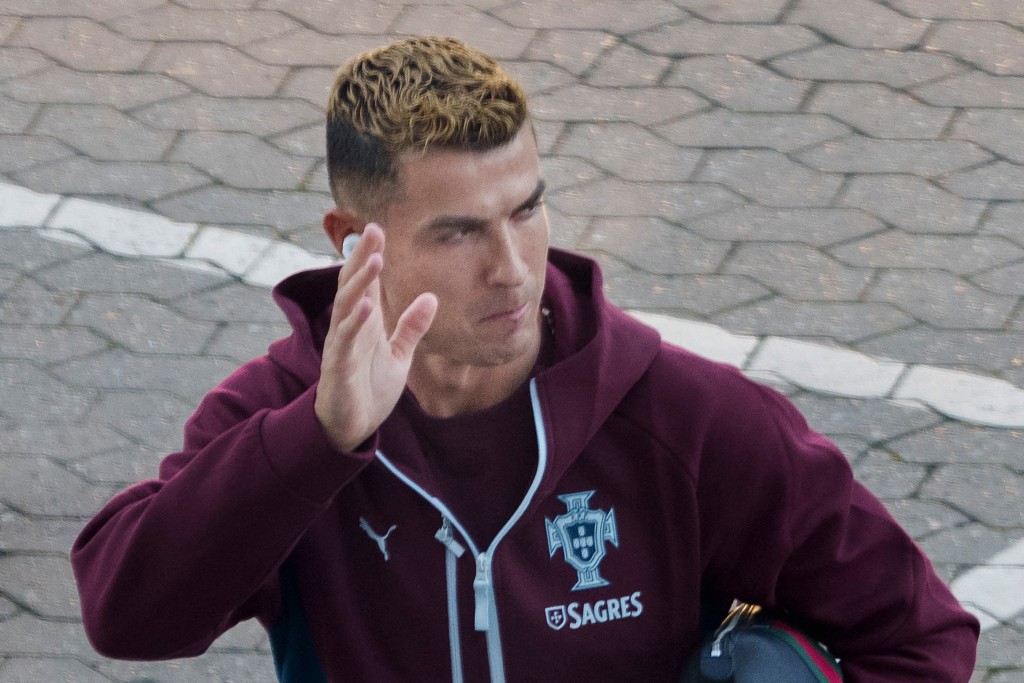 Photo by LISELOTTE SABROE / RITZAU SCANPIX / AFP Portugal's forward #07 Cristiano Ronaldo waves to fans as he arrives for a training session at Parken stadium in Copenhagen, Denmark, on September 30, 2026, on the eve of their Nations League Group A4 match against Denmark.
