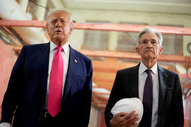 FILE PHOTO: U.S. President Donald Trump and Federal Reserve Chair Jerome Powell speak during a tour of the Federal Reserve Board building, which is currently undergoing renovations, in Washington, D.C., U.S., July 24, 2025. REUTERS/Kent Nishimura/File Photo/File Photo