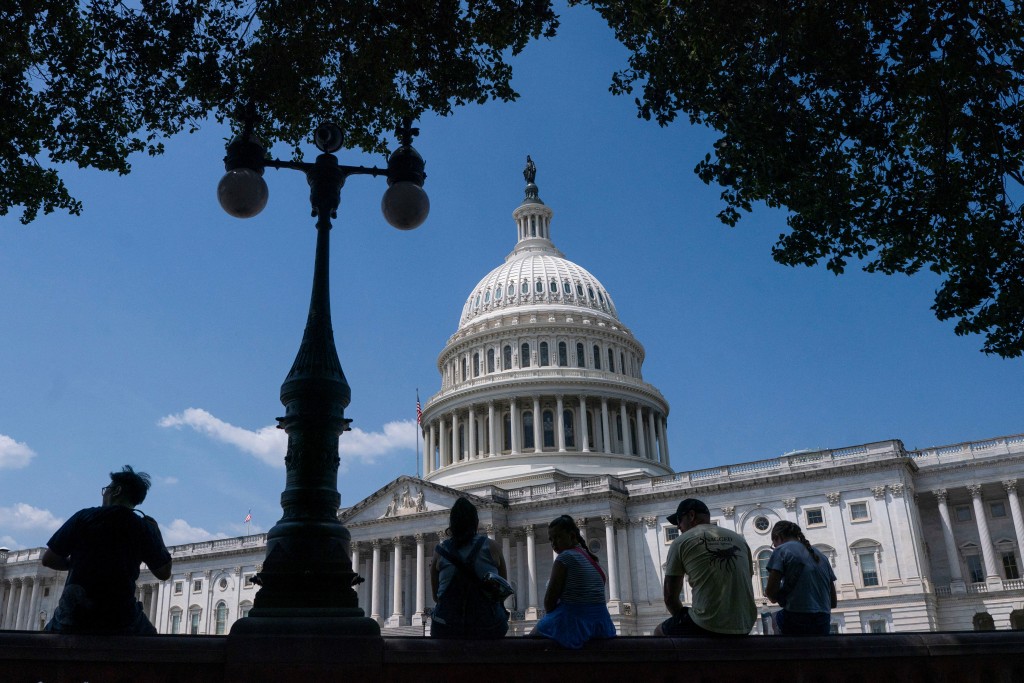 Visitors to the U.S. Capitol rest in the shade on Capitol Hill in Washington, D.C., U.S., June 25, 2025. (Reuters)