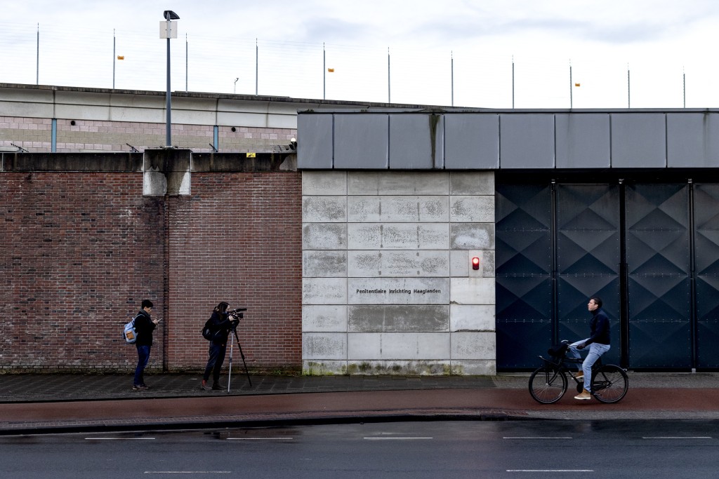 Photo by RAMON VAN FLYMEN / ANP / AFP  Members of the media wait outside of the Hague Penitentiary Institution (Penitentiary Institution Haaglanden), which also serves as a United Nations Detention Unit (UNDU) which holds those on trial at the International Criminal Court (ICC), in Scheveningen a district of the The Hague on March 12, 2025.