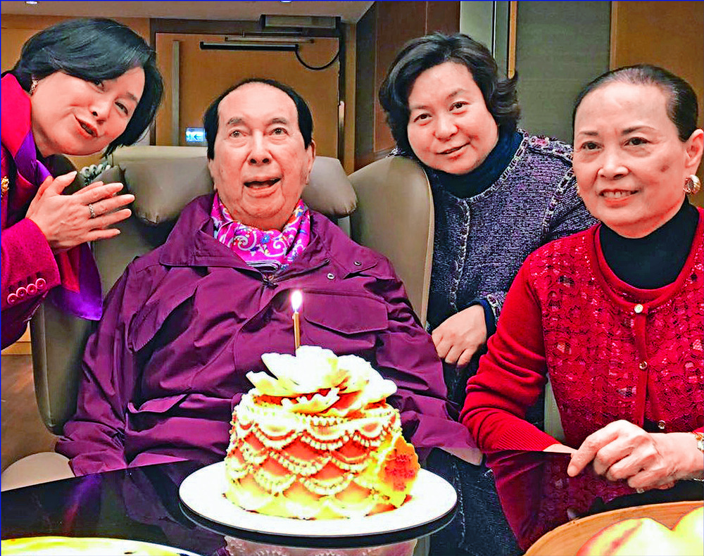 Stanley Ho had children with, from above, wives Lucina Laam, Ina Chan and Angela Leong. Far right: Ho checks out a table. 