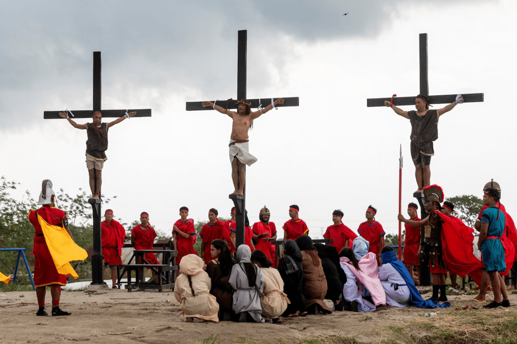 Filipino Catholic Ruben Enaje is nailed to the cross during his reenaction of the crucifixion of Jesus Christ on Good Friday, in San Fernando, Pampanga, Philippines, March 29. REUTERS/Lisa Marie David