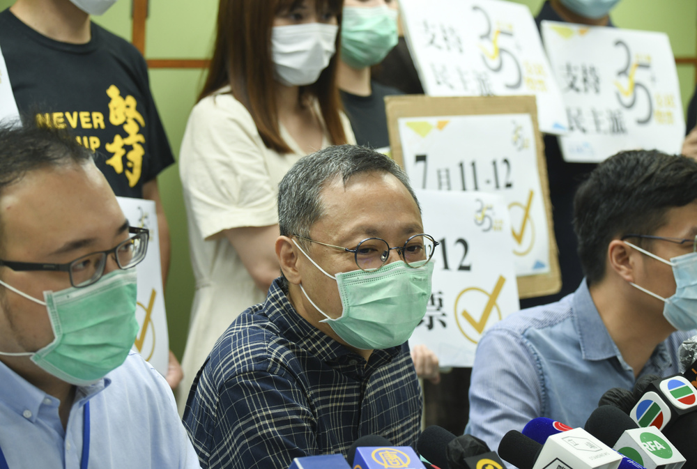 Benny Tai, left, and Joshua Wong. SING TAO Benny Tai, left, and Joshua Wong. SING TAO