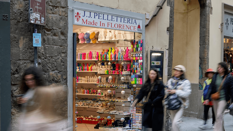 People walk past a shop selling souvenirs of Michelangelo's 16th century statue of David, in downtown Florence, central Italy, Monday, March 18, 2024. Michelangelo’s David has been a towering figure in Italian culture since its completion in 1504. But curators worry the marble statue’s religious and political significance is being diminished by the thousands of refrigerator magnets and other souvenirs focusing on David’s genitalia. The Galleria dell’Accademia’s director has positioned herself as David’s defender and takes swift aim at those profiteering from his image. (AP Photo/Andrew Medichi People walk past a shop selling souvenirs of Michelangelo's 16th century statue of David, in downtown Florence, central Italy, Monday, March 18, 2024. Michelangelo’s David has been a towering figure in Italian culture since its completion in 1504. But curators worry the marble statue’s religious and political significance is being diminished by the thousands of refrigerator magnets and other souvenirs focusing on David’s genitalia. The Galleria dell’Accademia’s director has positioned herself as David’s defender and takes swift aim at those profiteering from his image. (AP Photo/Andrew Medichi