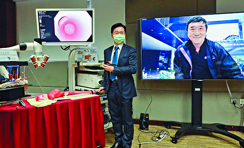 Philip Chiu, near right, and Joseph Sung say the microrobots, above, may offer unprecedented medical treatments. Philip Chiu, near right, and Joseph Sung say the microrobots, above, may offer unprecedented medical treatments.