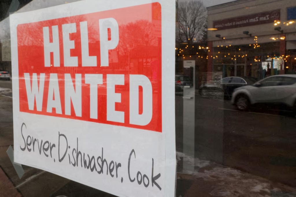 A ?Help Wanted? sign hangs in restaurant window in Medford, Massachusetts, U.S., January 25, 2023. REUTERS