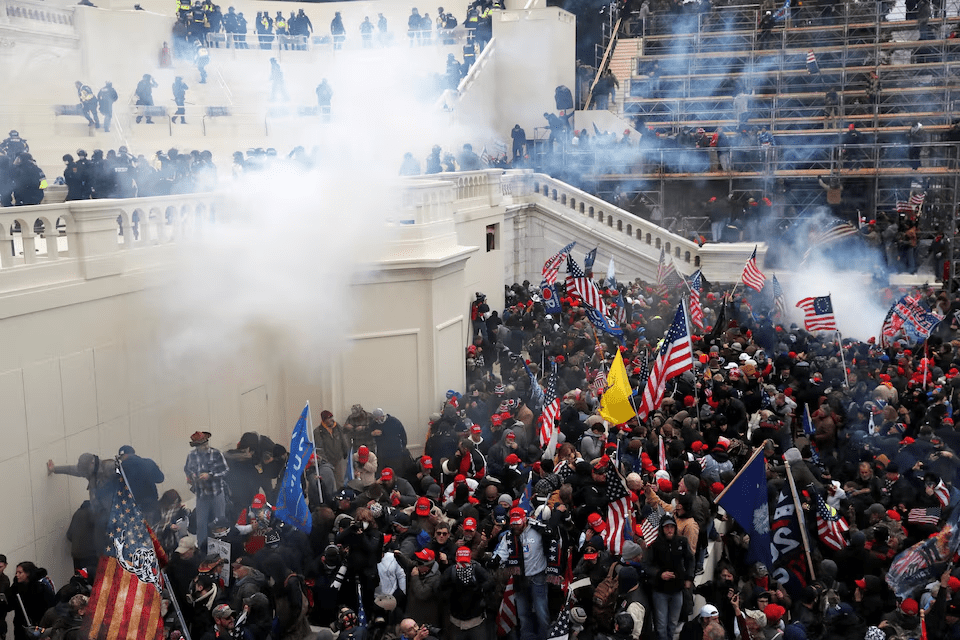 Police release tear gas into a crowd of pro-Trump protesters during clashes at a rally to contest the certification of the 2020 U.S. presidential election results by the U.S. Congress, at the U.S. Capitol Building in Washington, U.S, January 6, 2021. REUTERS/Shannon Stapleton
