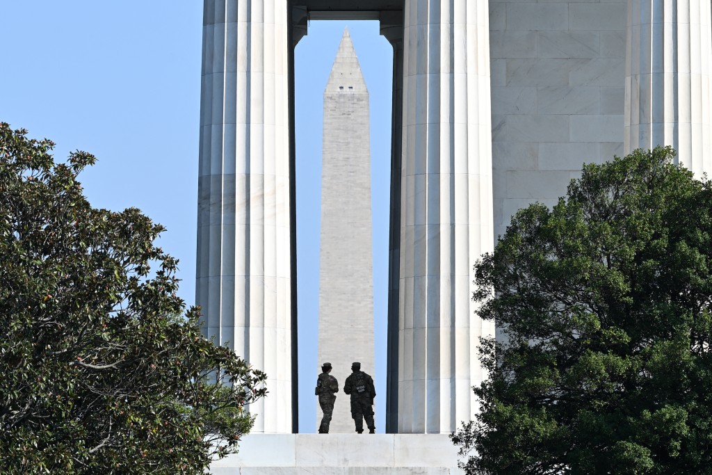 Photo by ALEX WROBLEWSKI / AFP  US National Guard members patrol inside of the Lincoln Memorial in Washington, DC, on October 27, 2026.