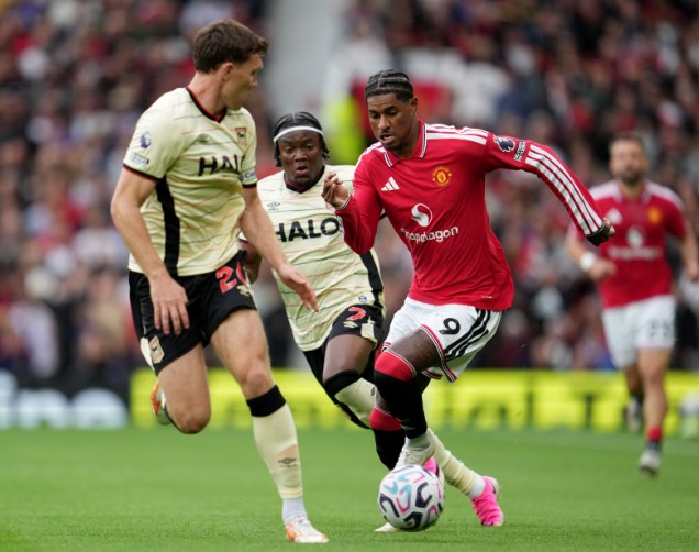 Marcus Rashford in action against Ipswich’s Dara O’Shea, left, and Abdul Fatawu. REUTERS