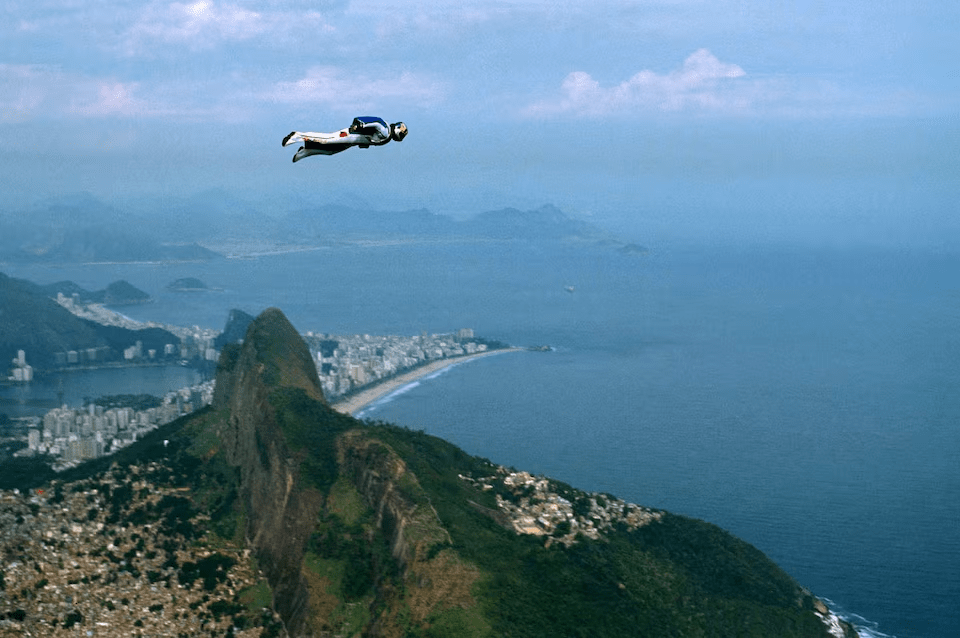 Austrian base-jumper Felix Baumgartner, 32, glides through the air past "Dois Irmaos" mountain in Rio de Janeiro, Brazil January 8, 2001. REUTERS/File Photo 