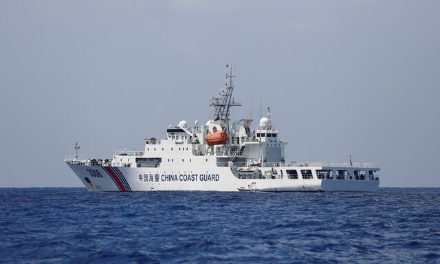 A China Coast Guard vessel patrols at the disputed Scarborough Shoal April 6, 2017. Picture taken April 6, 2017 REUTERS/Erik De Castro/File Photo A China Coast Guard vessel patrols at the disputed Scarborough Shoal April 6, 2017. Picture taken April 6, 2017 REUTERS/Erik De Castro/File Photo