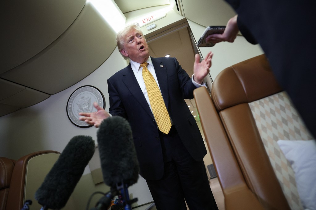 U.S. President Donald Trump speaks to members of the press for the first time aboard the new Air Force One while in flight from RAF Mildenhall AFB to Joint Base Andrews July 8, 2026 after leaving the United Kingdom. Trump, who switched from the old Air Force One to the new Air Force One while in the U.K. is returning from his visit to Ankara, Turkey where he attended the NATO summit. Win McNamee/Getty Images/AFP