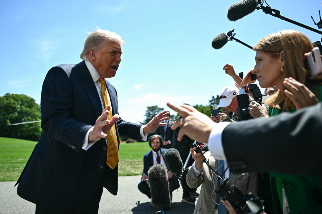 Photo by KENT NISHIMURA / AFP  US President Donald Trump speaks to the press before walking to board Marine One as he departs from the South Lawn of the White House in Washington, DC, on May 12, 2026.